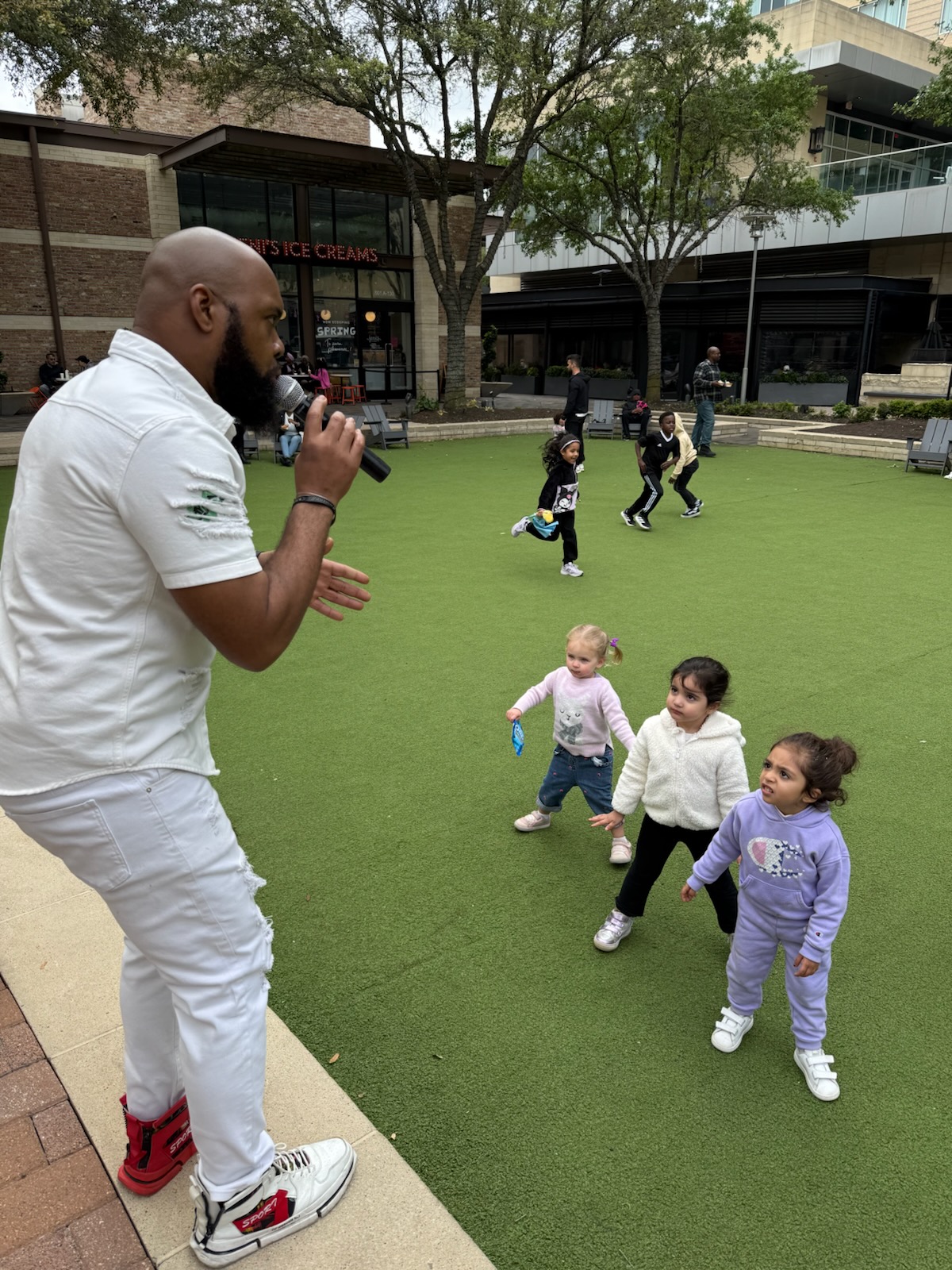 Kameron Music performing at a family-friendly outdoor Houston event